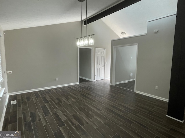 unfurnished dining area featuring lofted ceiling with beams and dark hardwood / wood-style floors