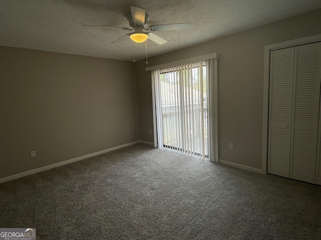 unfurnished bedroom featuring ceiling fan, carpet, access to outside, and a textured ceiling