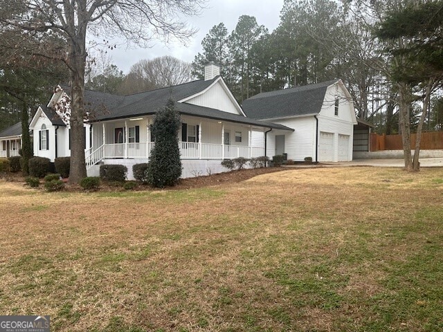 view of property exterior featuring a yard and covered porch