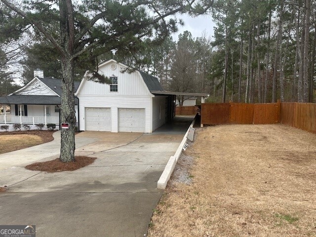 view of front of house featuring a garage and a carport