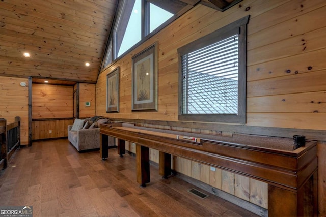 playroom featuring wood ceiling, lofted ceiling, hardwood / wood-style floors, and wood walls