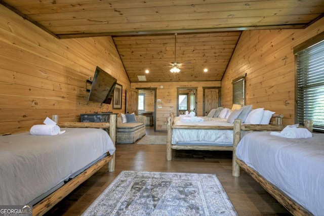 bedroom featuring high vaulted ceiling, dark hardwood / wood-style floors, wood ceiling, and wooden walls