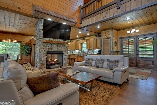 living room featuring wood ceiling, a chandelier, and wood walls