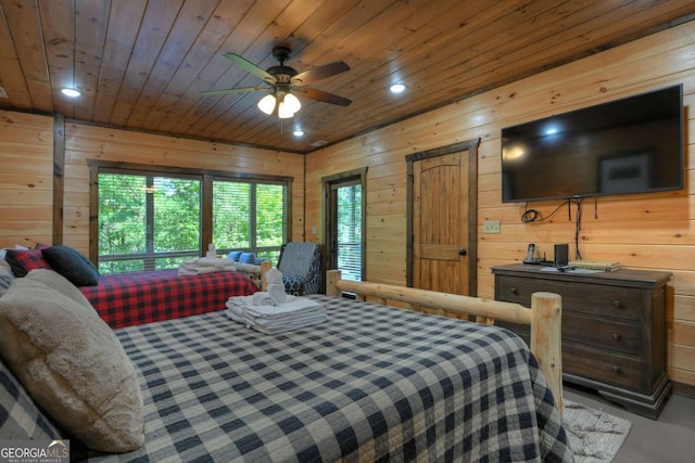 bedroom with wood ceiling and wood walls