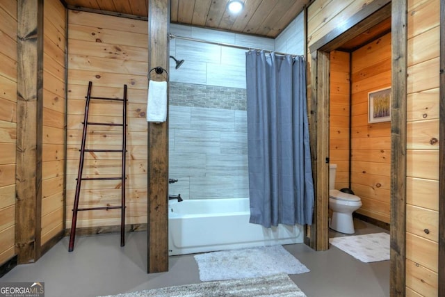 bathroom featuring shower / bath combination with curtain, wooden ceiling, concrete floors, toilet, and wood walls