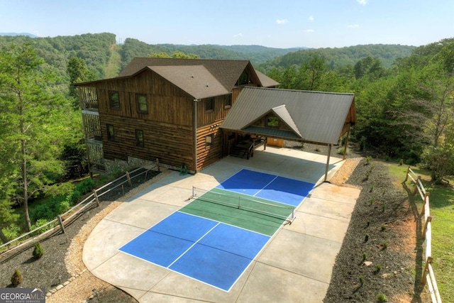 view of sport court featuring tennis court