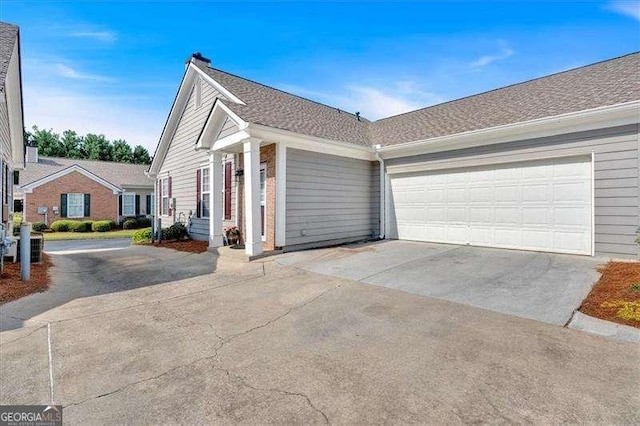 view of side of property with a garage