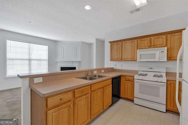 kitchen featuring white appliances, kitchen peninsula, sink, and a textured ceiling