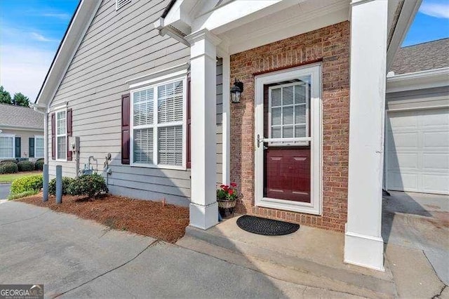 property entrance with a garage