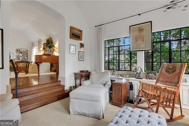 sitting room with vaulted ceiling