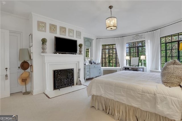 carpeted bedroom featuring multiple windows, radiator heating unit, and ornamental molding