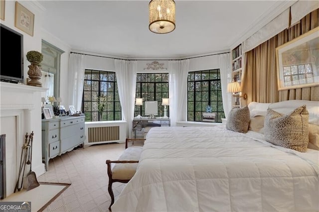 carpeted bedroom featuring crown molding, radiator heating unit, and multiple windows