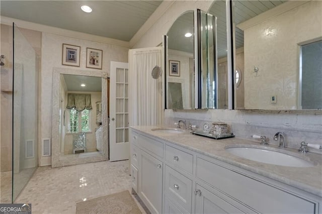 bathroom featuring vanity and crown molding