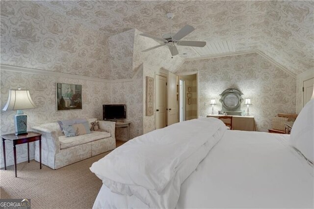 carpeted bedroom with ceiling fan and lofted ceiling