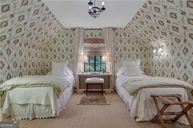 bedroom featuring light colored carpet and an inviting chandelier