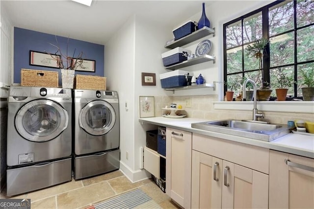 washroom featuring sink and washing machine and dryer