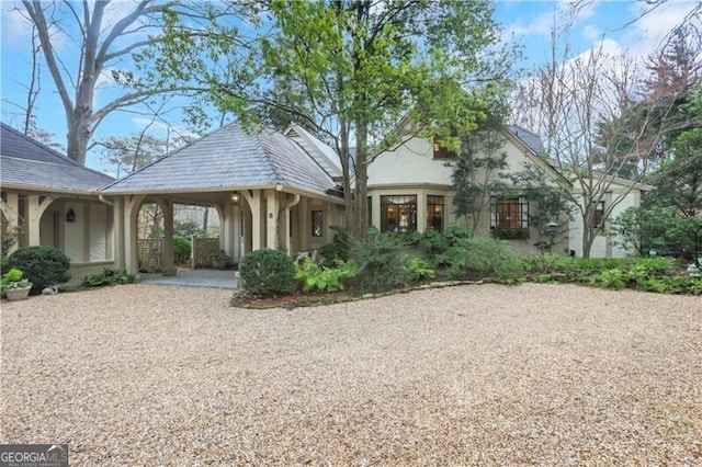 view of front of property featuring a carport