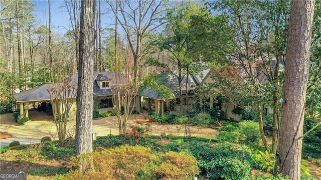 obstructed view of property featuring a carport