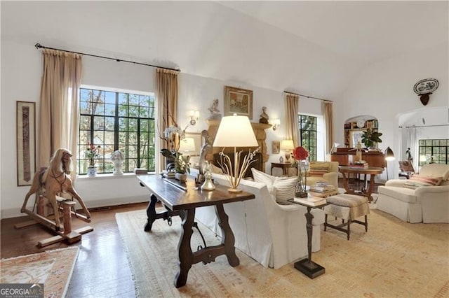 interior space with hardwood / wood-style flooring and vaulted ceiling