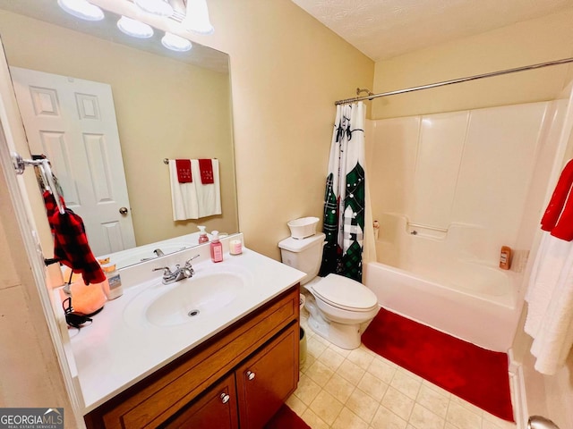 full bathroom featuring vanity, toilet, shower / bath combo with shower curtain, and a textured ceiling