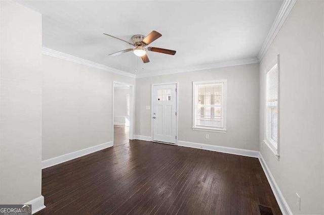 spare room featuring ornamental molding, ceiling fan, and dark hardwood / wood-style flooring