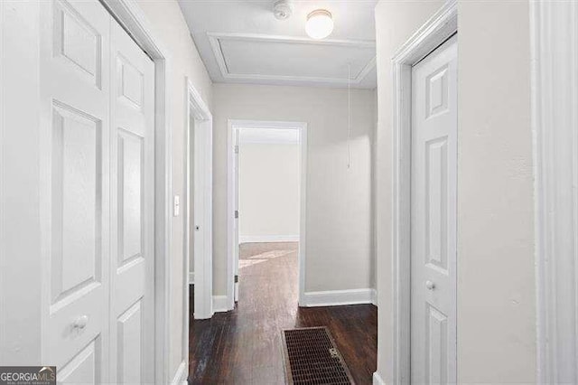 corridor featuring dark hardwood / wood-style floors