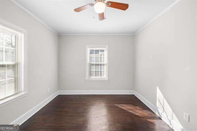 spare room with dark wood-type flooring, ceiling fan, and crown molding