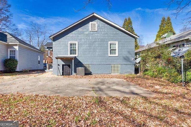 back of property featuring cooling unit and a patio area