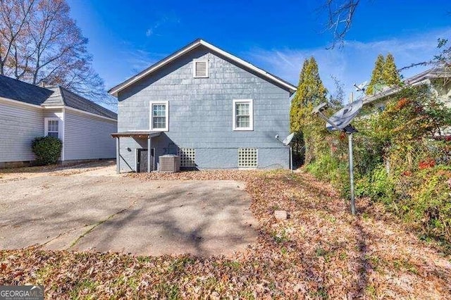 back of house featuring central AC