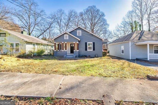 view of front of house featuring a porch and a front yard