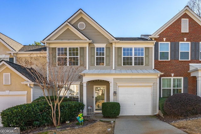 traditional home with a garage and driveway