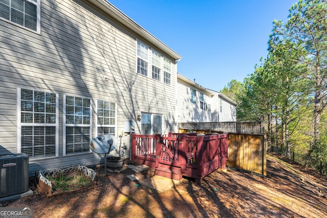 wooden deck with central AC unit