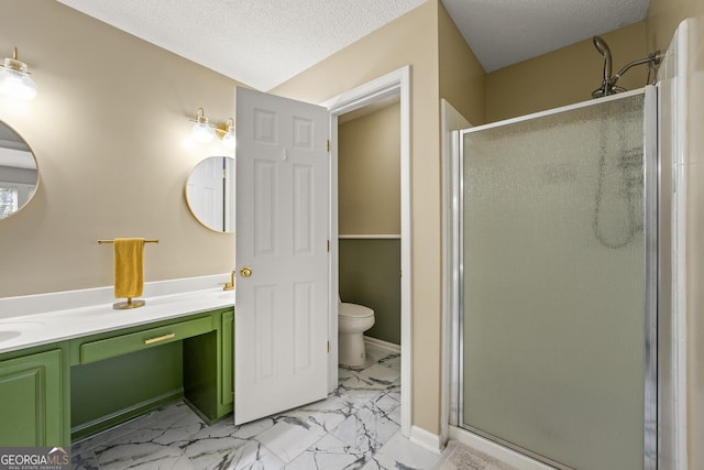 bathroom with toilet, a stall shower, marble finish floor, and a textured ceiling