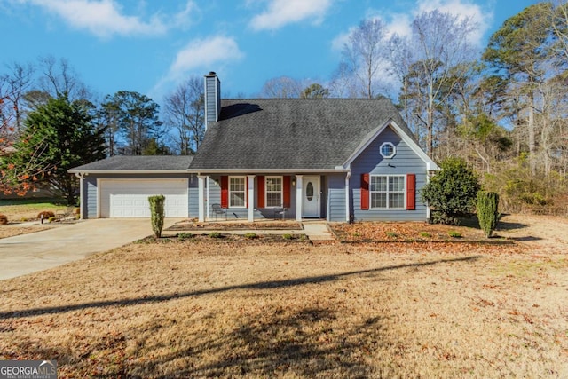 view of front of house with a garage, a front yard, and a porch