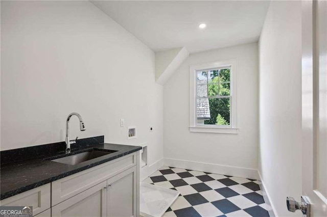 laundry area with cabinets, hookup for a washing machine, sink, and hookup for an electric dryer