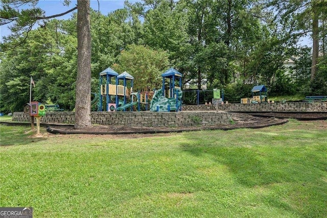 view of jungle gym featuring a lawn