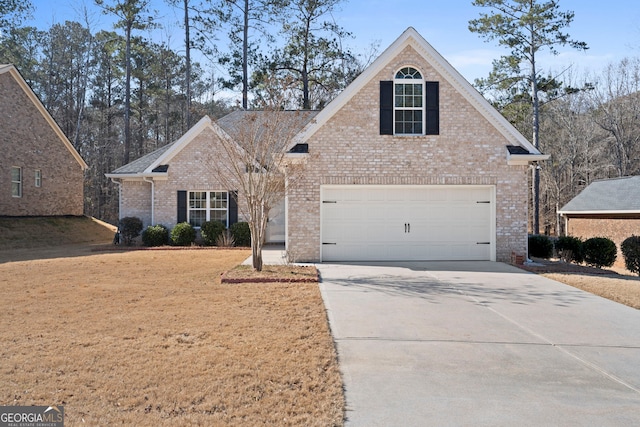 view of property featuring a garage and a front yard