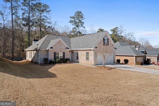 view of front facade with a garage and a front lawn