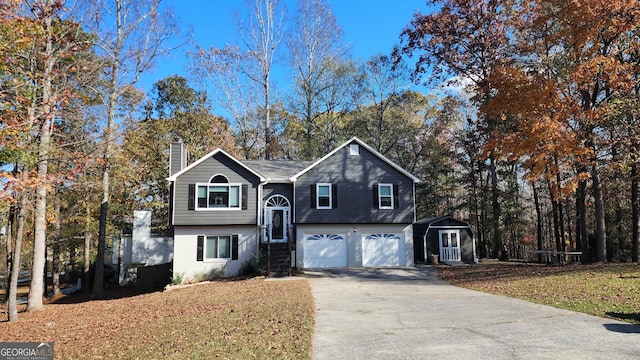 view of front of property featuring a garage and a front yard