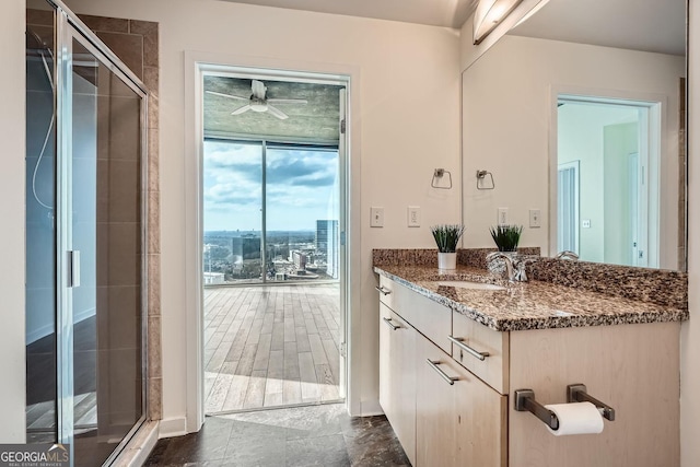 bathroom with an enclosed shower and vanity