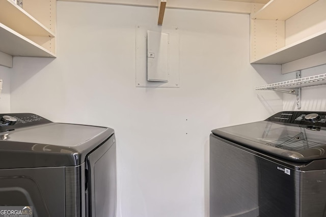 laundry area featuring electric panel and washer and dryer