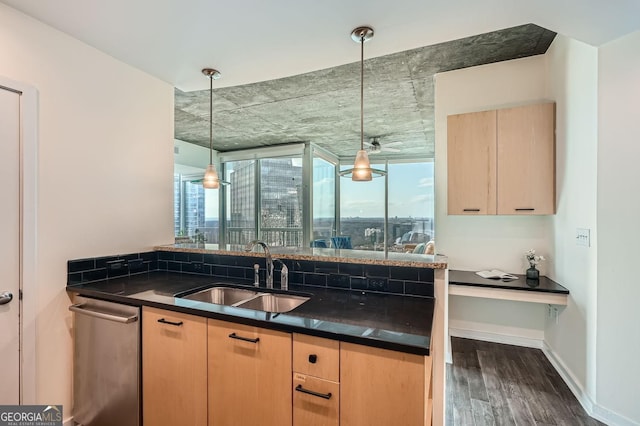 kitchen featuring dishwasher, sink, hanging light fixtures, dark wood-type flooring, and light brown cabinets