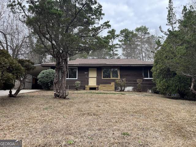 ranch-style house with a front lawn