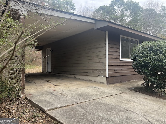 view of property exterior featuring a carport