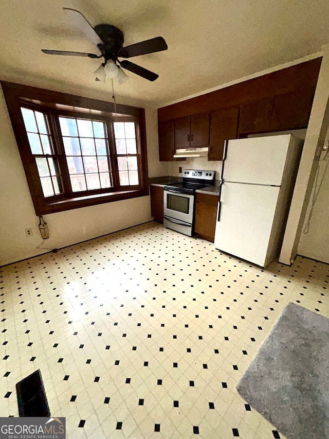 kitchen featuring white refrigerator, ceiling fan, dark brown cabinetry, and stainless steel electric range