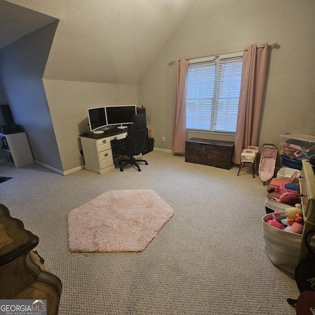 office featuring vaulted ceiling, light colored carpet, and a textured ceiling