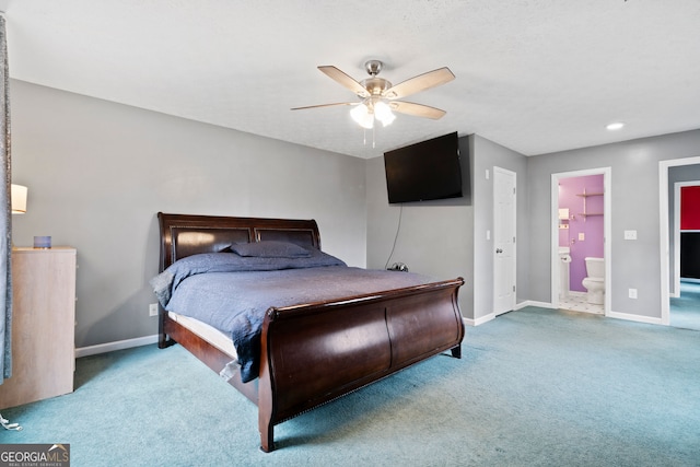 carpeted bedroom featuring ensuite bath and ceiling fan