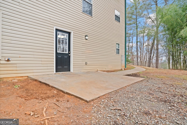 doorway to property with a patio