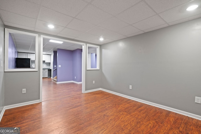 168 Ridgecrest Cir, Ellijay, GA 30540 - empty room with wood finished floors, a paneled ceiling, baseboards, and recessed lighting