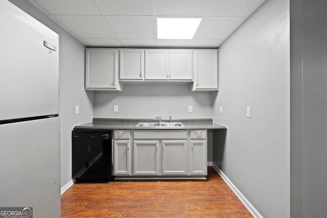 168 Ridgecrest Cir, Ellijay, GA 30540 - kitchen with freestanding refrigerator, dishwasher, a sink, a paneled ceiling, and wood finished floors